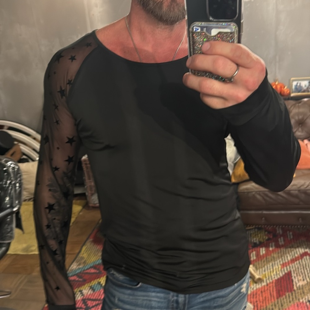 Sexy men’s asymmetrical, long sleeve shirt with one sheer sleeve with stars